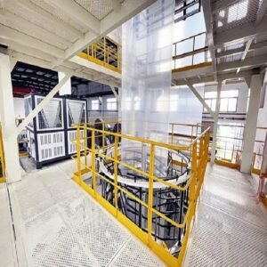 A roll of transparent, glossy biodegradable plastic film unfurled on a surface, representing eco-friendly packaging material.