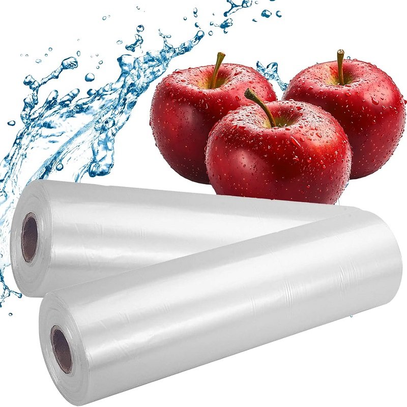 Two rolls of biodegradable fruit and vegetable bags are accompanied by a red apple with water droplets, highlighting the product's freshness and environmental friendliness.