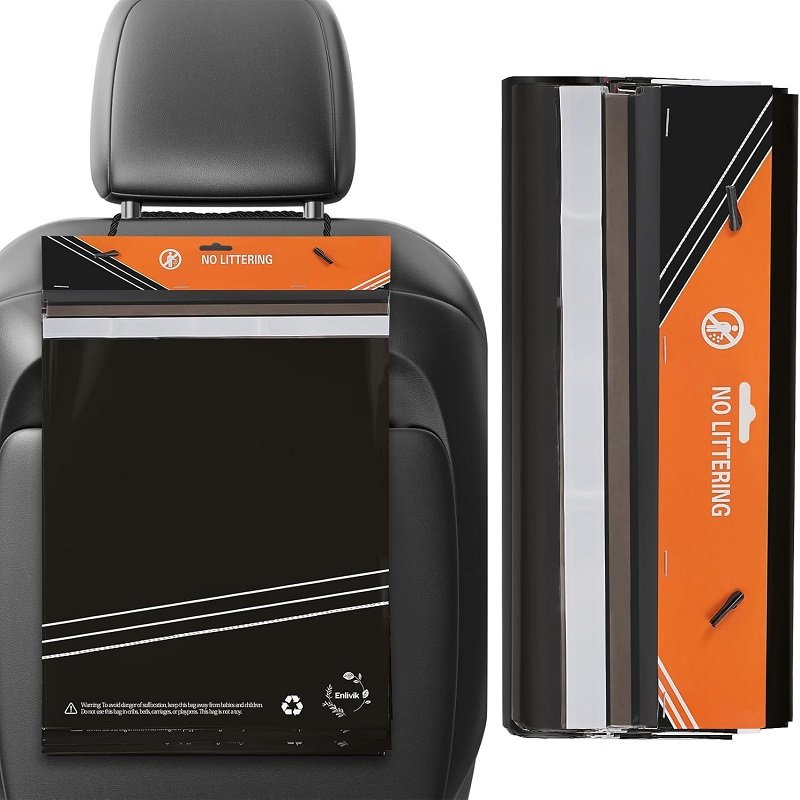 The black vehicle-mounted cleaning garbage bag device with orange decorative strips is installed on the car seat back, highlighting its biodegradable function and in-vehicle usage scenario.