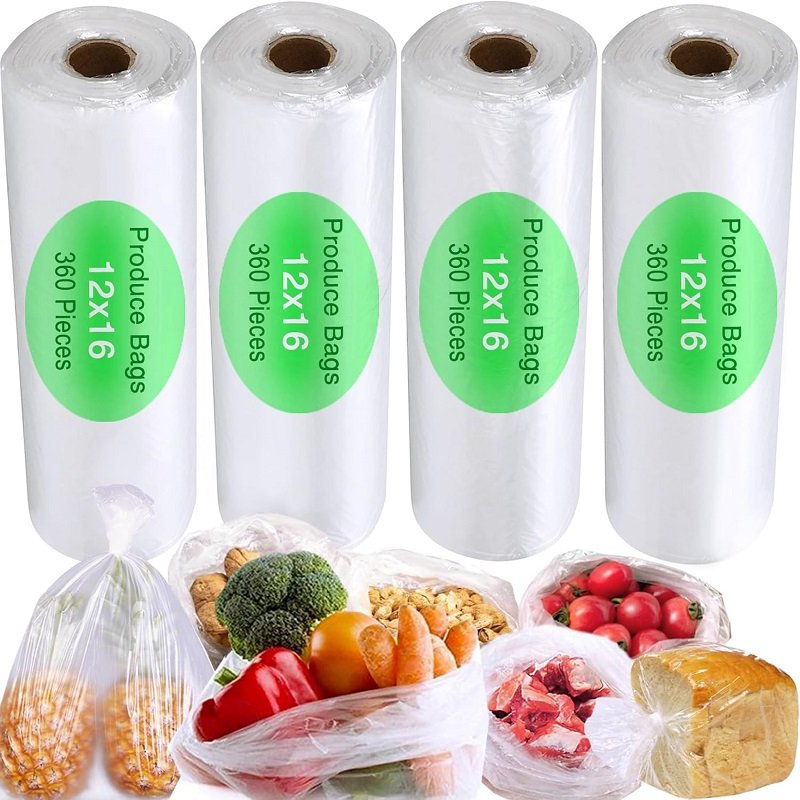 Five rolls of biodegradable fruit and vegetable bags, with a white body and green labels, and various fruits and vegetables placed underneath, highlighting the product packaging and usage scenarios.