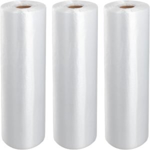 Three rolls of white biodegradable fruit and vegetable bags are placed side by side. The rolls are smooth and have round holes on the top, showing the product packaging in a simple overall manner.