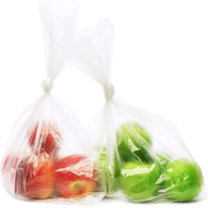 Two biodegradable fruit and vegetable bags contain red apples and green apples respectively. The bags are transparent, showing the product's usage status and load-bearing capacity.