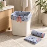 Small drawstring compostable garbage bags in periwinkle film with a four-gallon bathroom bin