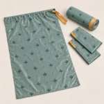 Flat large compostable drawstring bag with matching roll and folded liners