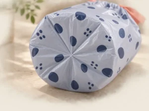 Radial star-seal bottom construction on a small drawstring compostable garbage bag