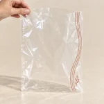 Empty flat open-top anti-fog food bag with clear front and narrow printed edge
