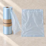 Perforated roll of handleless compostable produce bags with one bag dispensed