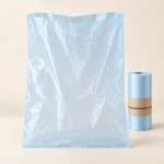 Flat open-top compostable produce bag with no handles beside its dispensing roll